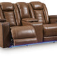 Gruaro - Power Reclining Loveseat With Console / Adjustable Headrest - Amber