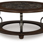 Frallyn - Round Cocktail Table - Dark Brown