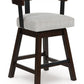 Haddigan - Dark Brown - Upholstered Swivel Barstool (Set of 2)