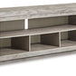 Naydell - XL TV Stand w/Fireplace Option - Gray - Fraser Furniture & Mattresses