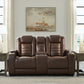 High Impact - Power Reclining Loveseat With Console / Adj Hdrst - Tobacco