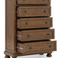 Zackaryn - Five Drawer Chest - Warm Brown