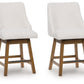 Cabalynn - Oatmeal / Light Brown - Upholstered Swivel Barstool (Set of 2)